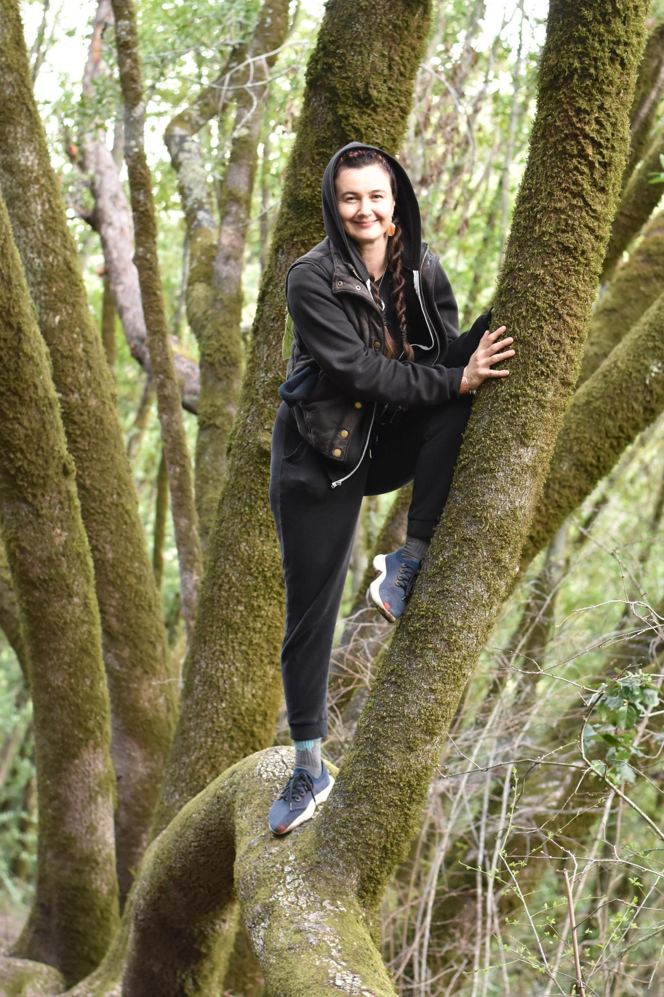 Patricia climbing a tree